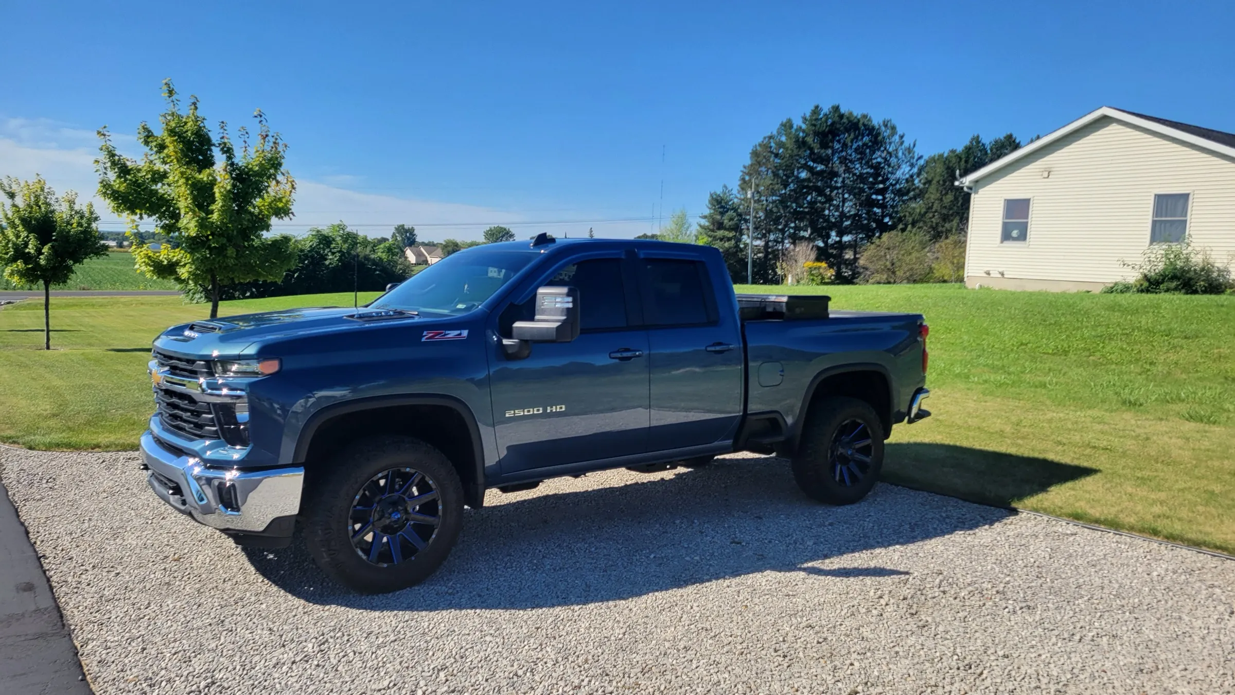 Steel blue Chevrolet Silverado 2500 HD with ceramic tint